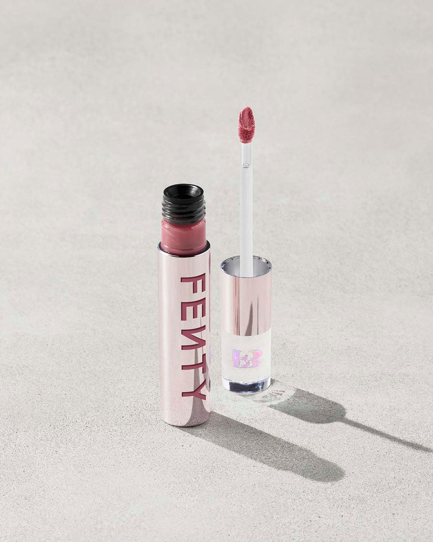 An open Fenty Icon Velvet lipstick tube on a light background.